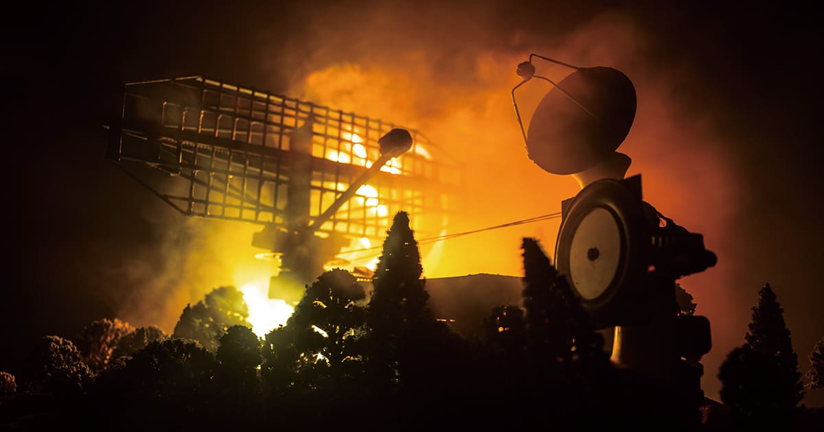 Silhouettes of satellite dishes or radio antennas against night sky. Space observatory.