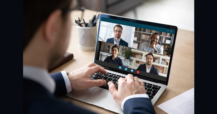 Multiracial colleagues engaged at group meeting online laptop screen view