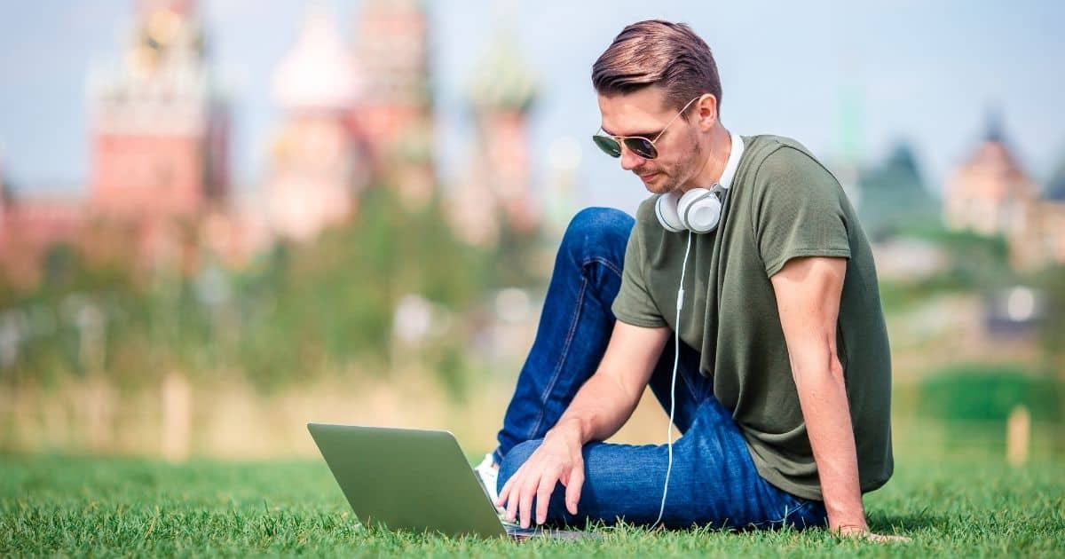 1200 Man Is Working By Laptop While Relaxing Park