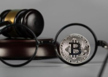 1200 view bitcoin through eyeglasses lens closeup